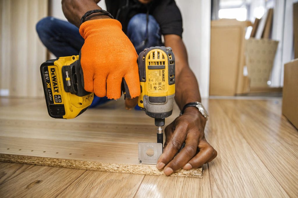 handyman assembling a furniture